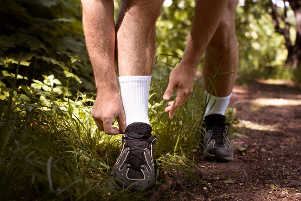 front-view-man-tying-shoelaces (1).jpg